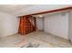 Open basement space with exposed wood beam, storage shelves, and a single window at 8602 N 39Th St, Longmont, CO 80503