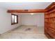 Basement with exposed beam, built-in shelving, and window for natural light at 8602 N 39Th St, Longmont, CO 80503