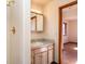 Cozy bathroom with updated vanity, tile backsplash, and a shower with gold fixtures at 8602 N 39Th St, Longmont, CO 80503