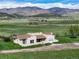 Exterior shot of charming Southwest-style home with mountain views at 8602 N 39Th St, Longmont, CO 80503