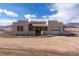 Charming southwestern home with unique architectural details, desert landscape, and bright turquoise accents at 8602 N 39Th St, Longmont, CO 80503