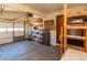 Spacious garage with shelving for storage and an overhead door for vehicle access at 8602 N 39Th St, Longmont, CO 80503