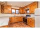 Bright kitchen featuring stainless steel appliances, tiled backsplash, Saltillo tile, and scenic mountain view at 8602 N 39Th St, Longmont, CO 80503