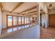 Open concept living room featuring wood beams, tile floors, and mountain views at 8602 N 39Th St, Longmont, CO 80503