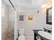 Cozy bathroom featuring an tiled shower, neutral paint, and a classic-style vanity at 2047 S Milwaukee St # 4, Denver, CO 80210