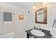 Classic bathroom with a granite countertop, vanity mirror, and a clean design at 2047 S Milwaukee St # 4, Denver, CO 80210