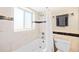 Clean bathroom boasts a tiled shower/tub combo and modern fixtures at 2047 S Milwaukee St # 4, Denver, CO 80210