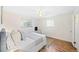Bright bedroom with carpet, white walls, and natural light from a window creating a comfortable retreat at 2047 S Milwaukee St # 4, Denver, CO 80210