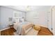Bright bedroom with hardwood floors, neutral colors, and two windows offering ample natural light at 2047 S Milwaukee St # 4, Denver, CO 80210
