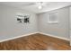 This bedroom is complete with hardwood floors, ceiling fan and large windows at 2047 S Milwaukee St # 4, Denver, CO 80210