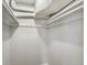 Empty white walk-in closet with high shelves and hooks for storage at 2047 S Milwaukee St # 4, Denver, CO 80210