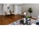 Open concept dining area with hardwood floors, neutral decor and bright light fixtures at 2047 S Milwaukee St # 4, Denver, CO 80210