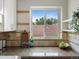 Bright kitchen featuring granite countertops, tile backsplash and a large window with a view at 2047 S Milwaukee St # 4, Denver, CO 80210