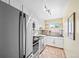 Spacious kitchen with stainless steel refrigerator and appliances, and stone tile floors at 2047 S Milwaukee St # 4, Denver, CO 80210