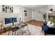 Open-concept living room features hardwood flooring, gray paint, and contemporary decor at 2047 S Milwaukee St # 4, Denver, CO 80210