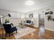 Cozy living room with hardwood floors, neutral paint, and contemporary furnishings at 2047 S Milwaukee St # 4, Denver, CO 80210