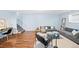 Cozy living room with stylish gray couches, light blue walls, and hardwood floors create an inviting space at 2047 S Milwaukee St # 4, Denver, CO 80210