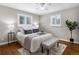 Bright bedroom features ample natural light, plush bedding, and hardwood floors at 2047 S Milwaukee St # 4, Denver, CO 80210
