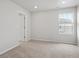 Neutral bedroom with carpet flooring, recessed lighting, and a bright window at 8819 Sedalia St, Commerce City, CO 80022