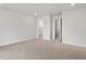 Spacious bedroom features neutral carpet, recessed lighting, walk in closet, and two entryways at 8819 Sedalia St, Commerce City, CO 80022