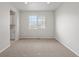 Empty bedroom with carpet, a window, and neutral walls at 8819 Sedalia St, Commerce City, CO 80022