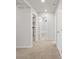 Carpeted hallway featuring multiple doors and openings to other rooms, with recessed lighting at 8819 Sedalia St, Commerce City, CO 80022