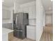 Kitchen with stainless steel refrigerator and light gray cabinets at 8819 Sedalia St, Commerce City, CO 80022