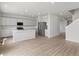 Bright open kitchen boasts stainless appliances, gray cabinets, and a large center island at 8819 Sedalia St, Commerce City, CO 80022