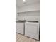 Well-lit laundry room with modern washer and dryer units, featuring durable vinyl flooring at 8819 Sedalia St, Commerce City, CO 80022