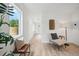 Bright hallway with light flooring and seating area at 5232 Columbine Ln, Denver, CO 80221