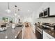 Modern kitchen with stainless steel appliances and an island at 5232 Columbine Ln, Denver, CO 80221