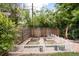 Backyard garden area with raised garden beds and a charming white picket fence at 585 Estes St, Lakewood, CO 80226