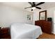 Spacious bedroom features hardwood floors, a ceiling fan, and abundant natural light at 585 Estes St, Lakewood, CO 80226