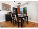 Elegant dining room with a classic table, stylish chairs, and a bright window offering pleasant natural light at 585 Estes St, Lakewood, CO 80226