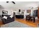 Open-concept living space with a modern kitchen, dining area, and comfortable seating, perfect for entertaining at 585 Estes St, Lakewood, CO 80226