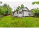 Well-maintained backyard with lush green lawn and mature trees at 182 Lois Cir, Louisville, CO 80027