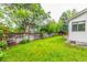 Lush, green backyard featuring a full privacy fence at 182 Lois Cir, Louisville, CO 80027