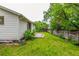 Spacious backyard featuring a stone patio and privacy fence at 182 Lois Cir, Louisville, CO 80027