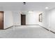 Finished basement features neutral paint, carpet flooring, a window and wood doors at 182 Lois Cir, Louisville, CO 80027
