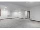 Spacious finished basement with carpet flooring, recessed lighting and neutral paint at 182 Lois Cir, Louisville, CO 80027