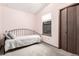 Cozy bedroom featuring a daybed, window and closet with neutral paint and carpet at 182 Lois Cir, Louisville, CO 80027