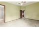 View of an empty bedroom with doorways to other rooms and neutral colored carpet at 182 Lois Cir, Louisville, CO 80027