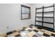 Bedroom with black shelving, window and colorful tiled flooring at 182 Lois Cir, Louisville, CO 80027