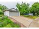 Charming home featuring a well-maintained front yard, a brick-lined driveway, and inviting curb appeal at 182 Lois Cir, Louisville, CO 80027