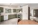 Well-lit kitchen features ample cabinet space, a double oven, and a light-colored countertop at 182 Lois Cir, Louisville, CO 80027