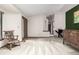 Open-concept living room with ample natural light and a view of the front entryway, creating a welcoming space at 182 Lois Cir, Louisville, CO 80027