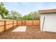Backyard featuring new wood fence, shed, mulch and a concrete pad for garden or grilling at 2988 S Hannibal St, Aurora, CO 80013