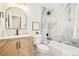 Updated bathroom showcasing a trendy vanity, tub with stylish tiling, and matte black hardware at 2988 S Hannibal St, Aurora, CO 80013