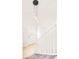 Bright foyer with white staircase, modern lighting, and front door at 2988 S Hannibal St, Aurora, CO 80013