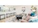 Open-concept living room with bar stool seating, blending modern decor with functional design at 2988 S Hannibal St, Aurora, CO 80013